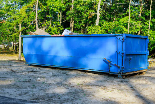 Large blue roll off dumpster at a residential property in Norwalk, CT.